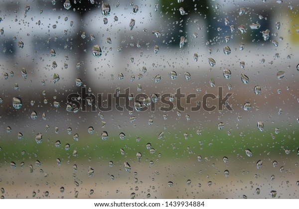 Car wind screen with rain\
water