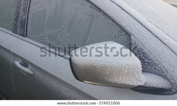 car window was frozen in\
the cold