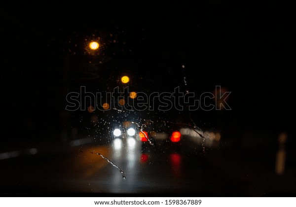  Car window at night\
and water drops