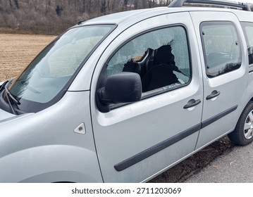 Car window smashed as a result of an act of vandalism