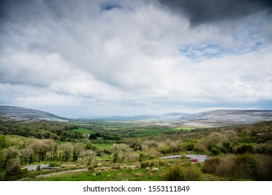 A Car Winds It Way Up A Small Irish Country Road