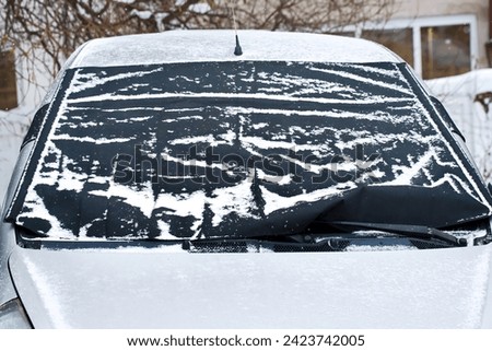 Car windshield cover from freezing winter weather including snow, frost and ice.  Frost guard windshield car cover. Windshield protector, snowcover. 
