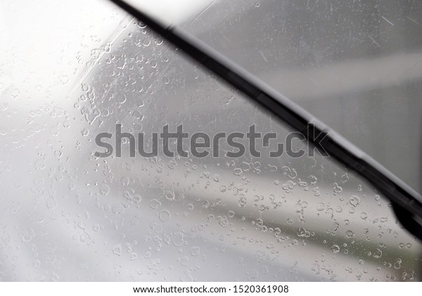 Car\
windshield during rain, windshield wipers\
work
