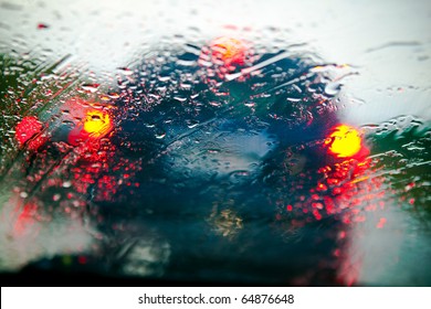 Car Windshield In Traffic Jam During Rain