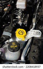 Car Windshield Washer Liquid Reservoir Yellow Plastic Cap. Close Up Shot, No People.