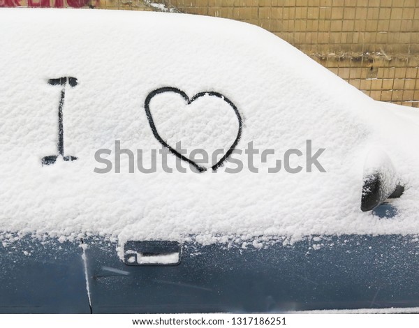 car in the winter. love\
background. Heart in the snow. Valentine\'s Day, Christmas and New\
Year