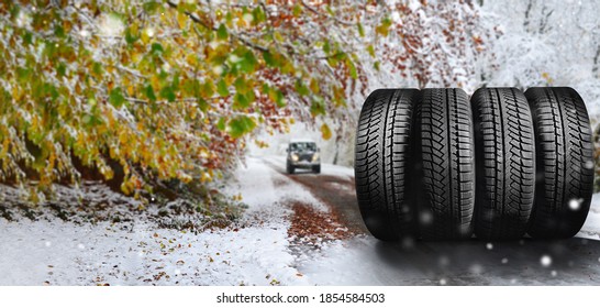 car and winter road with new winter tires in the foreground