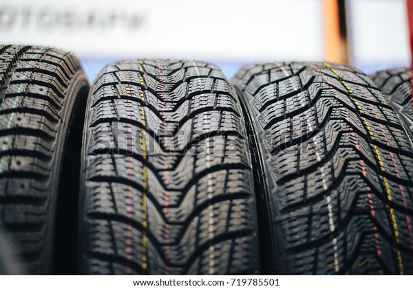 Car winter\
tires for car background. tire\
fitting