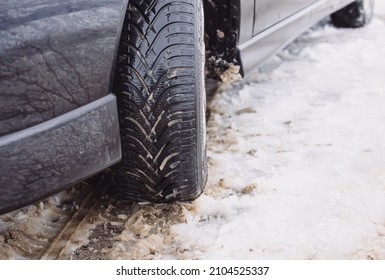 Car With Winter Tires On A Snow Covered Road, Winter Weather, Slippery Street, Dangerous To Drive