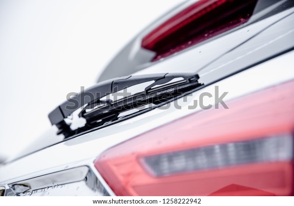 car
wiper blade on glass with shallow depth of
field