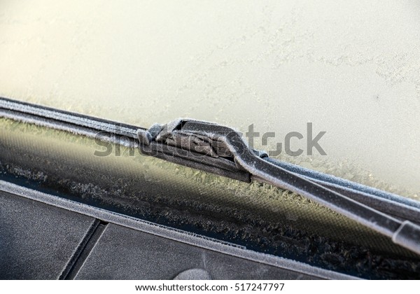 car wiper with\
frost .early on the morning