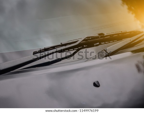 Car\
wiper of car parked on street sunlight\
background