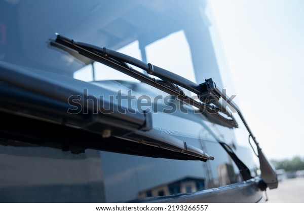 Car wipers\
close up. Large windshield and\
wipers.