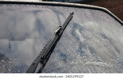 Car wipers wipe raindrops from car windows - Powered by Shutterstock