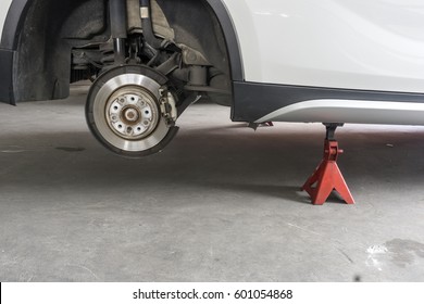 Car Without Wheel And Lift Up By Jack Stand ( Axle Stand ), Waiting For Tire Replacement