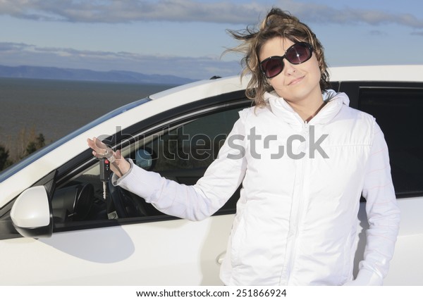Car. Woman driver happy
smiling