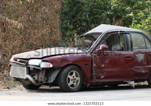 Car wreck caused by car collision. Car accident in\
the cemetery car