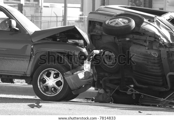 Car Wreck with\
Smashed Hood and Flipped\
Car