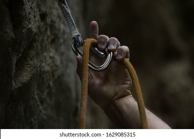 Carabiner And Climbing Rope. Athlete Hand During Bouldering Competition