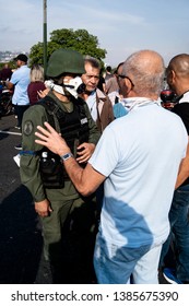 Caracas, Venezuela, 04/30/2019.

A Man Talks To A Bolivarian National Guard In Favor Of The Interim President Juan Guaidó.