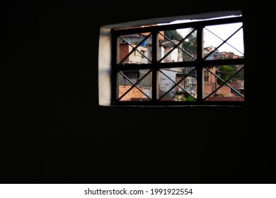 Caracas, Venezuela June 2021; Looking Through A Window At The Neighborhood. Popular And Poverty Zone In Venezuela. San Agustin Sector