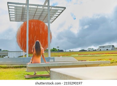 Caracas, Venezuela - May 1, 2022. Woman Appreciating Art Kinetic Sculpture Esfera Caracas, By Jesus Soto, On The Francisco Fajardo Highway.