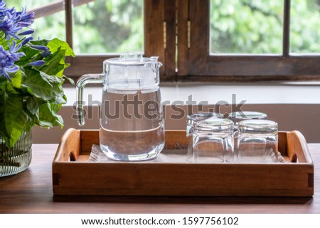 Similar – Image, Stock Photo Water carafe with glasses on a table