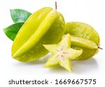 Carambola fruit with slice of star fruit and leaves isolated on a white background.
