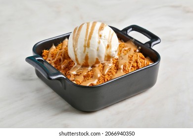 Caramel Apple Crisp With Ice Cream And Lotus Grounded On Top
Biscotti Crumble On Marble Background 