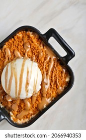 Caramel Apple Crisp With Ice Cream And Lotus Grounded On Top
Biscotti Crumble On Marble Background 