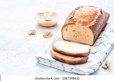 Caramel baileys loaf cake on light concrete background. Selective focus, space for text. - Shutterstock ID 1087398632