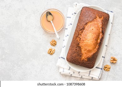 Caramel Banana Pound Cake On Light Concrete Background. Top View, Space For Text.