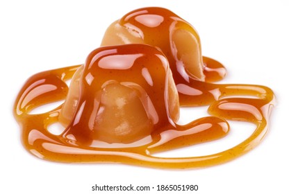 Caramel candies covered with melted sugar caramel isolated on white background.