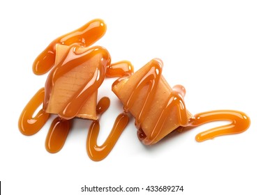 caramel candies and sweet sauce isolated on white background, top view - Powered by Shutterstock