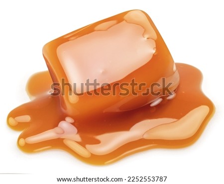Caramel candy in milk caramel sauce isolated on white background.