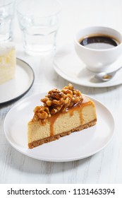 Caramel Cheese Cake With Coffee On White Wooden Table