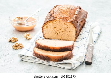Caramel cheesecake loaf bread on light concrete background. Selective focus, space for text. - Shutterstock ID 1081012934