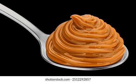 Caramel cream on black background, boiled condensed milk swirl in spoon - Powered by Shutterstock