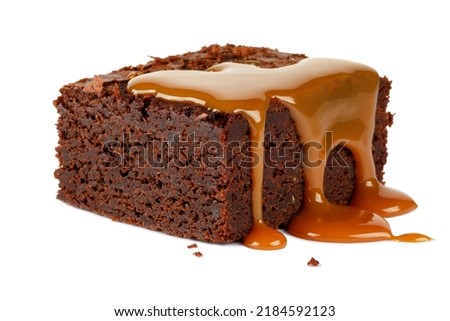 Caramel flowing on brownie isolated on white background