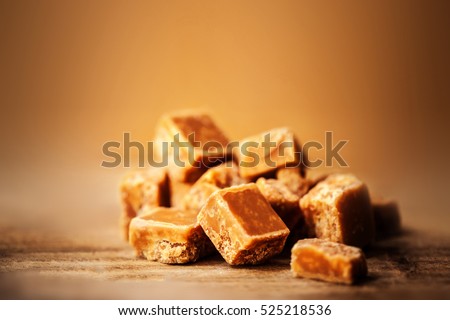 Caramel. Golden Butterscotch toffee candy caramels. Toffees with copy space macro.