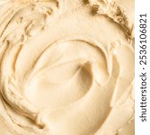 Caramel ice cream texture as background. Homemade beige coffee or caramel icecream, sorbet or frozen yogurt closeup, summer desert. Cosmetic body cream.