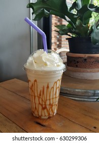 Caramel Milkshake With Whipped Cream In Takeaway Cup