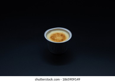 Crème Caramel
With Spoon On Black Background