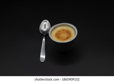 Crème Caramel
With Spoon On Black Background