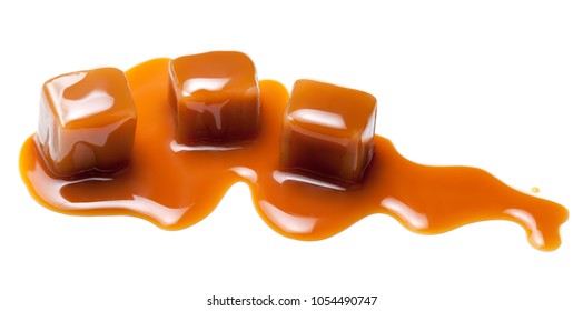 Caramel  Treats With Sauce. Toffee Candies Chunks Close-up Isolated On White Background
