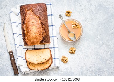 Caramel Walnut Ginger Pound Cake On Light Concrete Background. Top View, Space For Text.