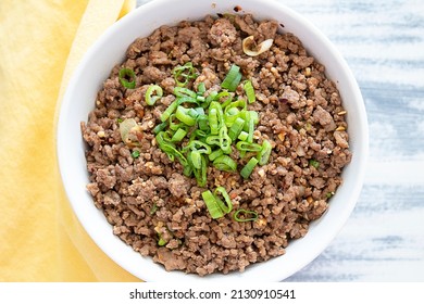 Caramelized ground beef topped with chopped green onion. - Powered by Shutterstock