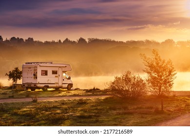 Caravan Camping On Lake Shore In Portugal. Camper Trip In Autumn Time. Foggy Misty Peace Morning, Sunrise Light.