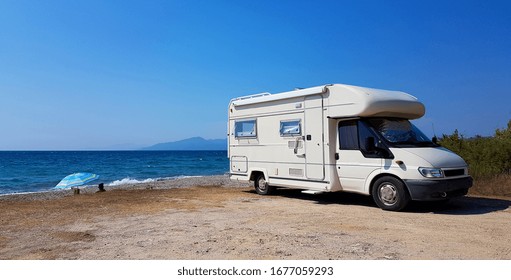 caravan car by the sea in summer holidays