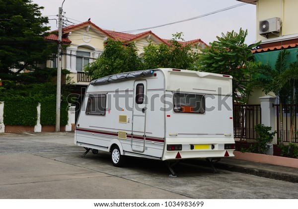 Caravan car in the\
city, car tourist\
trailer